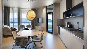 A modern kitchen with a built-in microwave, a coffee machine, and a sink. - Trogir sky view suites (Trogir)