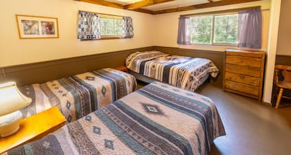 Step Back in Time: Historic 1912 Riverside Cabins at Camp Layman