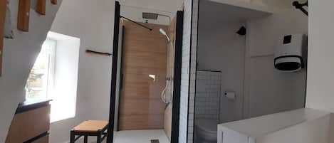 Shower, towels, soap, toilet paper