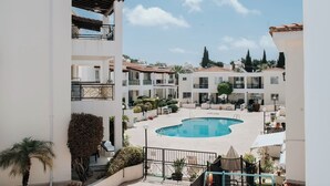 Pool - Sunny 2BR apartment with pool in quiet residential complex. (Paphos)