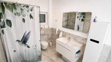 Shower, hair dryer, towels, soap