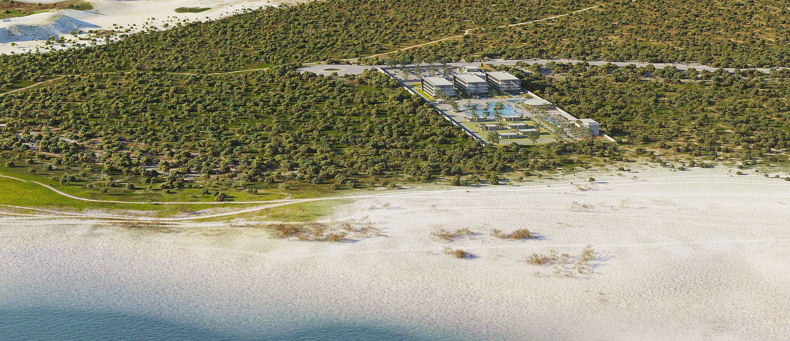 An aerial view of a resort with a large building complex, a swimming pool, and a beach area.
