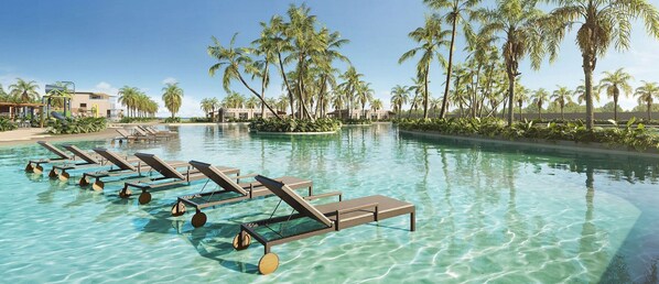 A pool with clear water, lounge chairs, and palm trees. - Jeriquiá Lagoa Resort - Gav Resorts (Jijoca)