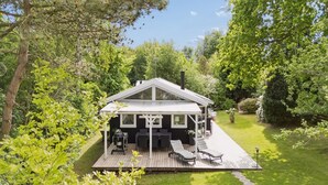 A house with a deck, outdoor seating, and a garden. - "Stig" - 1.1km from the sea by Interhome (Hornbæk)