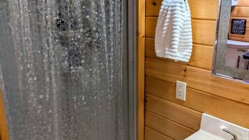 Shower, towels, soap, toilet paper