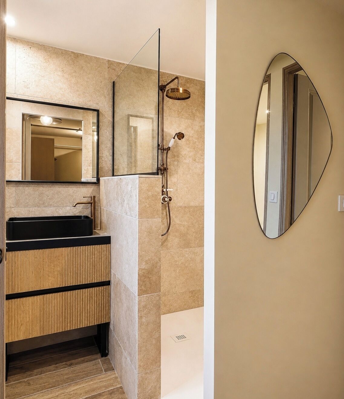 A modern bathroom with a rectangular sink, a mirror, and a shower with a handheld showerhead.