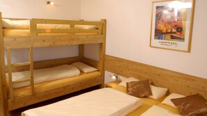 A bunk bed room with a framed picture on the wall. - Ski Lodge in Krimml With Swimming Pool (Krimml)