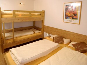 A bunk bed room with a framed picture on the wall. - Ski Lodge in Krimml With Swimming Pool (Krimml)