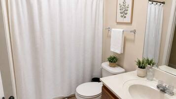 Shower, hair dryer, towels, shampoo