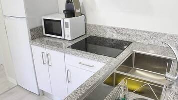Fridge, microwave, coffee/tea maker, toaster