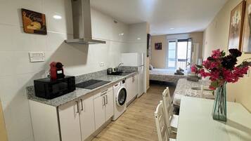 Microwave, coffee/tea maker, toaster, cookware/dishes/utensils