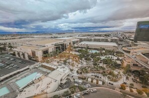 A large hotel complex with multiple buildings, a parking area, and a landscaped pool area. - Strip View Studio • No Resort Fee • Free Parking B18P1 (Las Vegas)