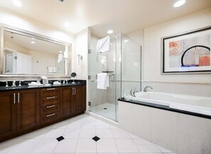 A modern bathroom with a large mirror, a glass shower enclosure, a bathtub, and a framed artwork on the wall. - Strip View Studio • No Resort Fee • Free Parking B18P1 (Las Vegas)
