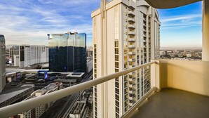 A high-rise building with a modern design, featuring multiple balconies and a glass facade. - SVS: PH Floor Strip View Balcony | Signature at MGM (Las Vegas)