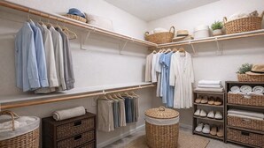 A neatly organized closet with hanging clothes, shelves, and storage baskets. - 2 BR Layout with Bonus Room • Quiet + Parking (Carson City)