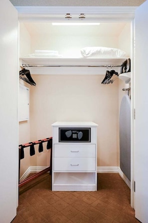 A compact bedroom with a bunk bed, a small white dresser, and a closet with hanging clothes. - SVS: Sphere Strip View Studio | Signature at MGM (Las Vegas)