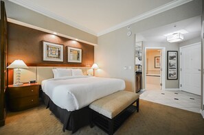 A hotel room with a large bed, bedside tables, a bench, and framed artwork on the wall. - PH Floor Studio • Strip View • Balcony • No Resort Fee D30S2 (Las Vegas)