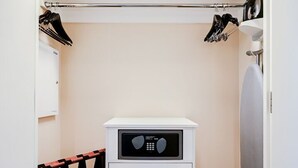A compact room with a bunk bed, a small white dresser, a heater, and a coat rack. - SVS: Strip View Studio | Signature at MGM (Las Vegas)