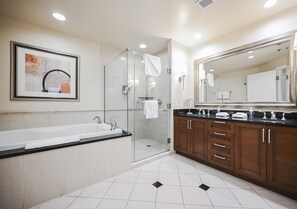 A modern bathroom with a glass shower enclosure, a large mirror, and a bathtub. - Strip View Studio • No Resort Fee • Free Parking B2O1 (Las Vegas)