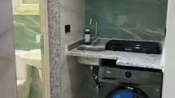 Shower, towels, soap, toilet paper