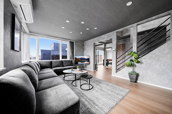 Apartment | Living area | 50-inch flat-screen TV with digital channels, table football