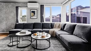 Apartment | Living area | 50-inch flat-screen TV with digital channels, foosball