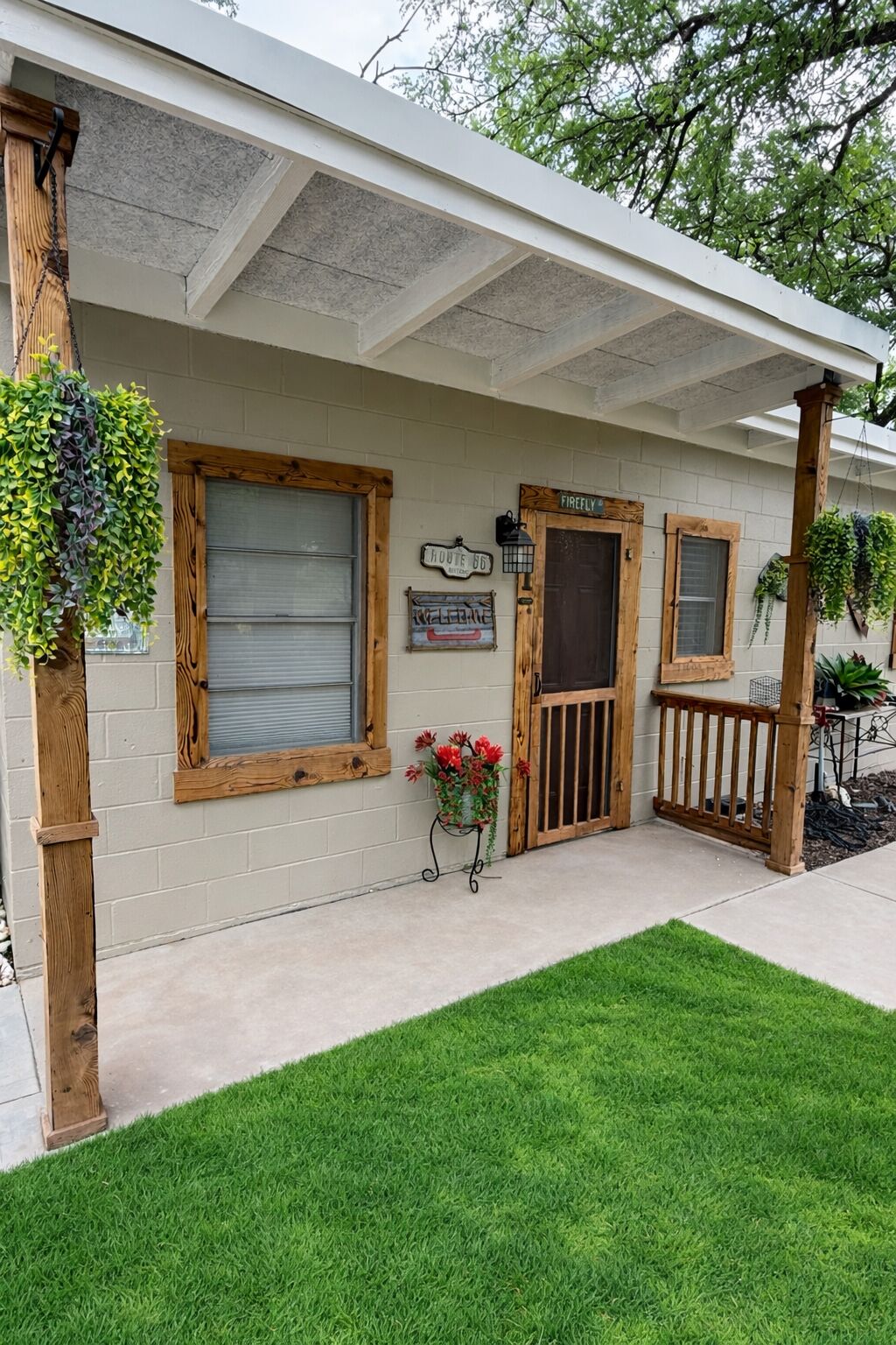 A building with a covered porch, a wooden door labeled 'Firefly,' and a sign reading 'Route 66.'