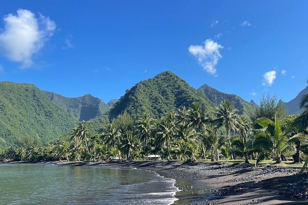 On the beach, black sand