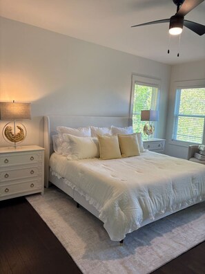 A bedroom with a bed, nightstands, a lamp, a ceiling fan, and a window. - 4 Bedroom Beauty in Vestavia, Minutes to 459, 65 (Mountain Brook)