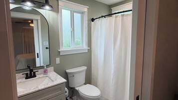 Shower, hair dryer, towels, soap