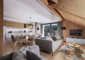 Ein modernes Loft mit Küche, Essbereich und Wohnzimmer.