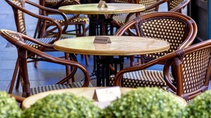 Outdoor wicker chairs and tables arranged on a sidewalk, with a 'RESERVED' sign on one table. - Evi-3B2B Free Parking! Walk to Casino! Sleeps 8! (Southbank)