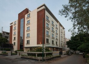 A multi-story building with a flat roof, rectangular windows, and a central entrance. - Nivasana Residences Vadodara (Vadodara)