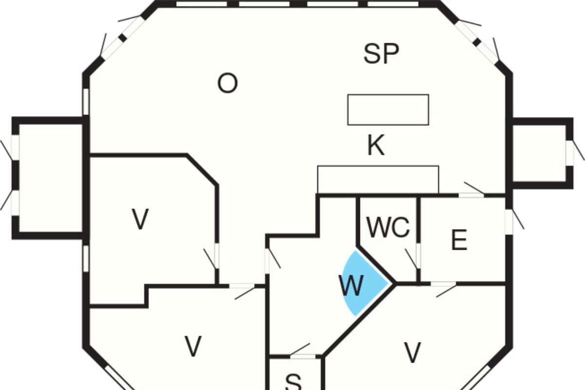 A floor plan with labeled rooms including a kitchen (K), WC, and a living area (V).
