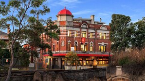 A historic hotel with a red dome and brick facade, featuring a prominent Imperial Hotel sign. - Imperial Hotel Paddington (Paddington)
