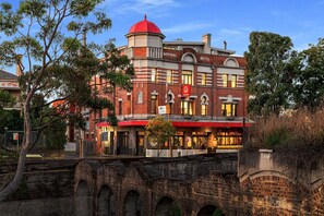 A historic hotel with a red dome and brick facade, featuring a prominent Imperial Hotel sign. - Imperial Hotel Paddington (Paddington)