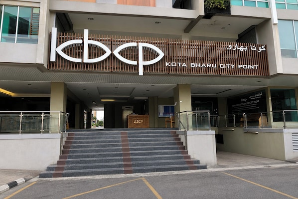 A building with a sign reading 'KOTA BHARU CITY POINT' and a staircase leading to the entrance. - Ain Studio Apartment (Kota Bharu)