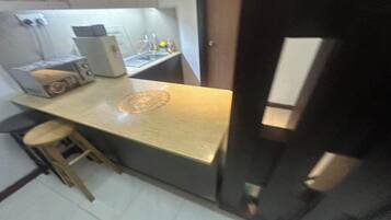 Minibar, desk, blackout curtains, iron/ironing board