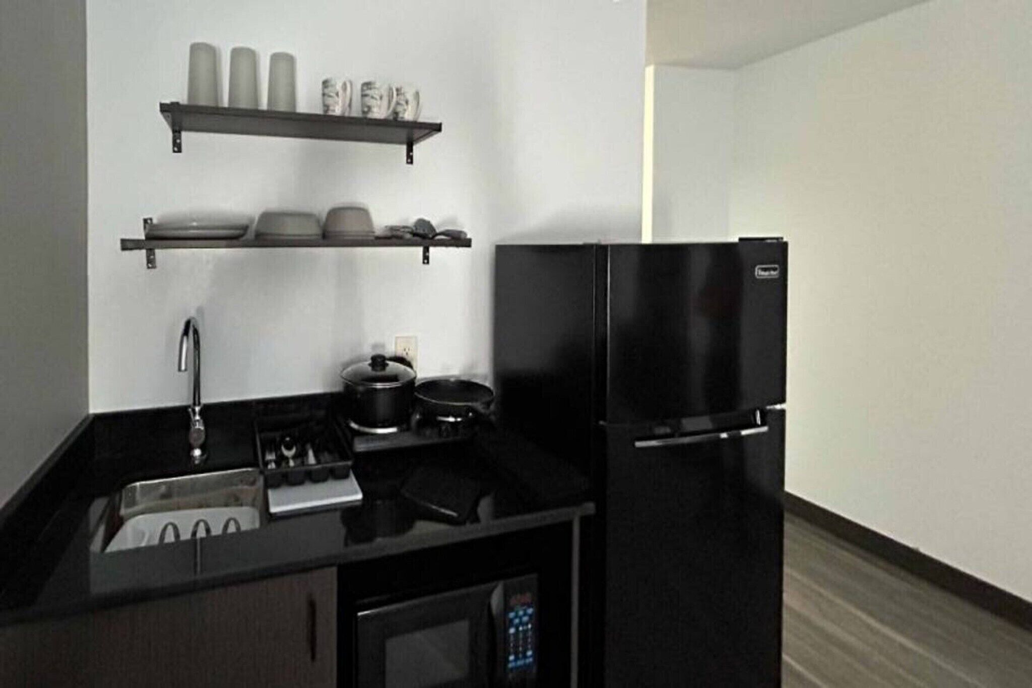 Fridge, microwave, stovetop, coffee/tea maker