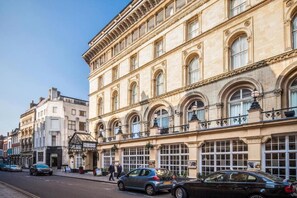 A historic building with arched windows and a classic facade. - Standard Family of 3 Room (Bristol)
