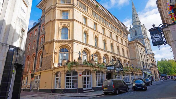 A historic building with a corner entrance, large windows, and a clock. - Bristol Grand Hotel By Sunday - Deluxe Double Room (Bristol)