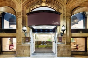 An ornate hotel entrance with a sign reading 'Manchester portland hotel.' - Standard Double Room (Manchester)