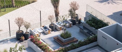 An outdoor seating area with planters and a modern architectural design.
