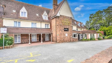 A traditional brick building with a sign reading 'The Thames Lodge.'