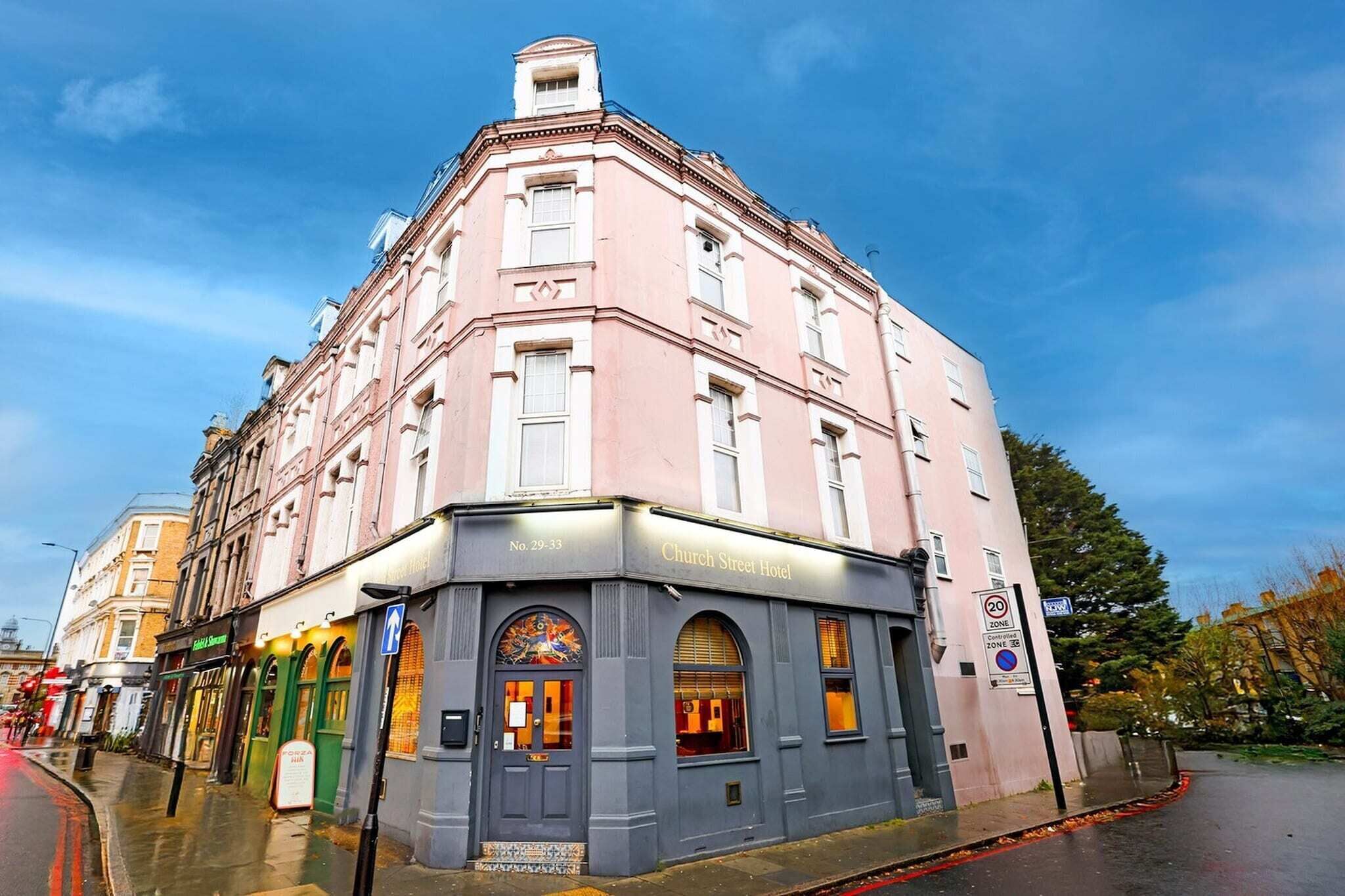 A corner building with a sign reading 'Church Street Hotel.'