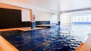 An indoor swimming pool with lanes, a diving board, and a no diving sign. - Holland House Hotel By Sunday Triple Room (Cardiff)