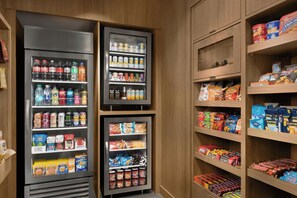 A vending machine stocked with various snacks and drinks.