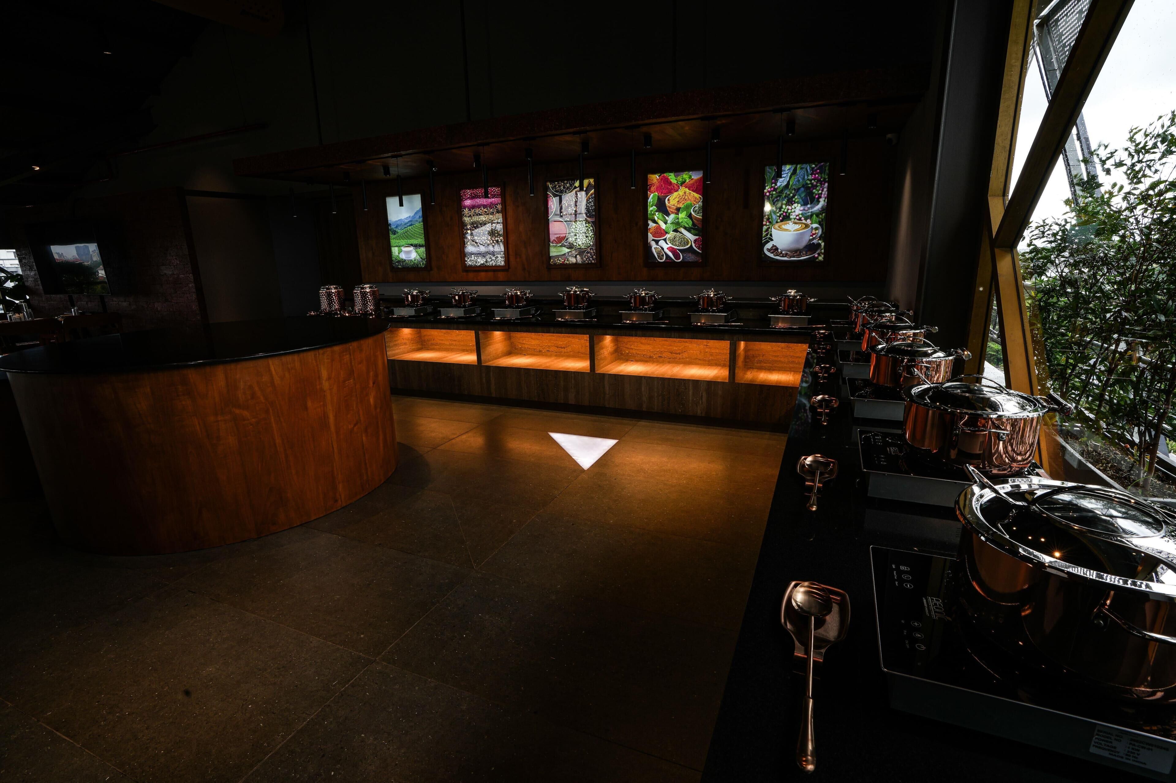 A bar area with a counter, stools, and a large window.