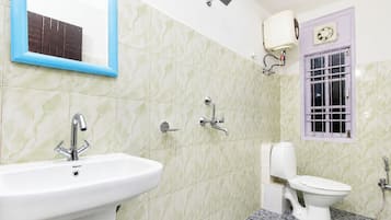 Shower, rainfall showerhead, slippers, towels