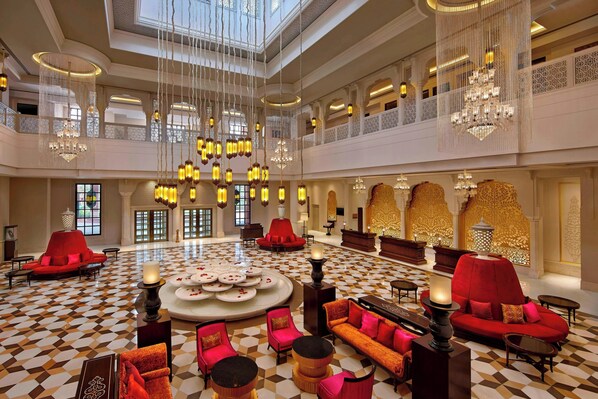 A spacious lobby with high ceilings, chandeliers, and a checkered floor. - Itc Rajputana A Luxury Collection Hotel (Jaipur)